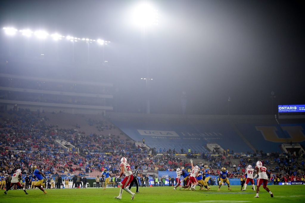 Nov 8, 2025; Pasadena, California, USA; UCLA Bruins quarterback Nico Iamaleava (9) drops back to pass against the Nebraska Cornhuskers during the second half at the Rose Bowl.