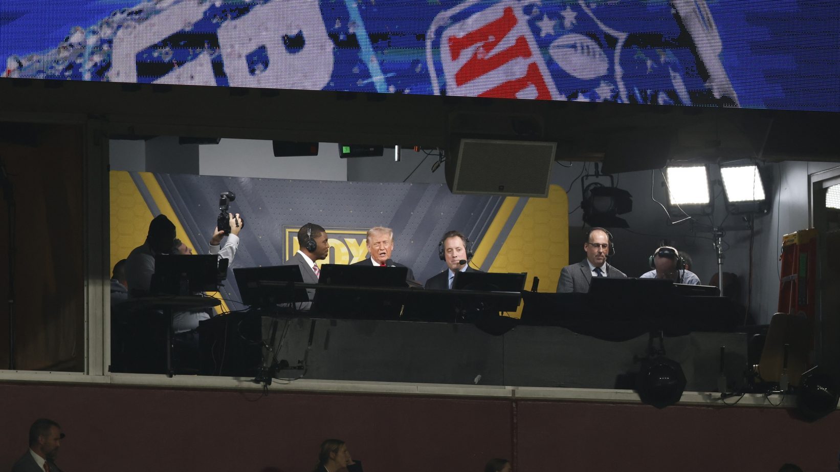Nov 9, 2025; Landover, Maryland, USA; President Donald Trump is interviewed by Fox play-by-play announcer Kenny Albert and analyst Jonathan Vilma during the third quarter of a game between the Washington Commanders and the Detroit Lions at Northwest Stadium