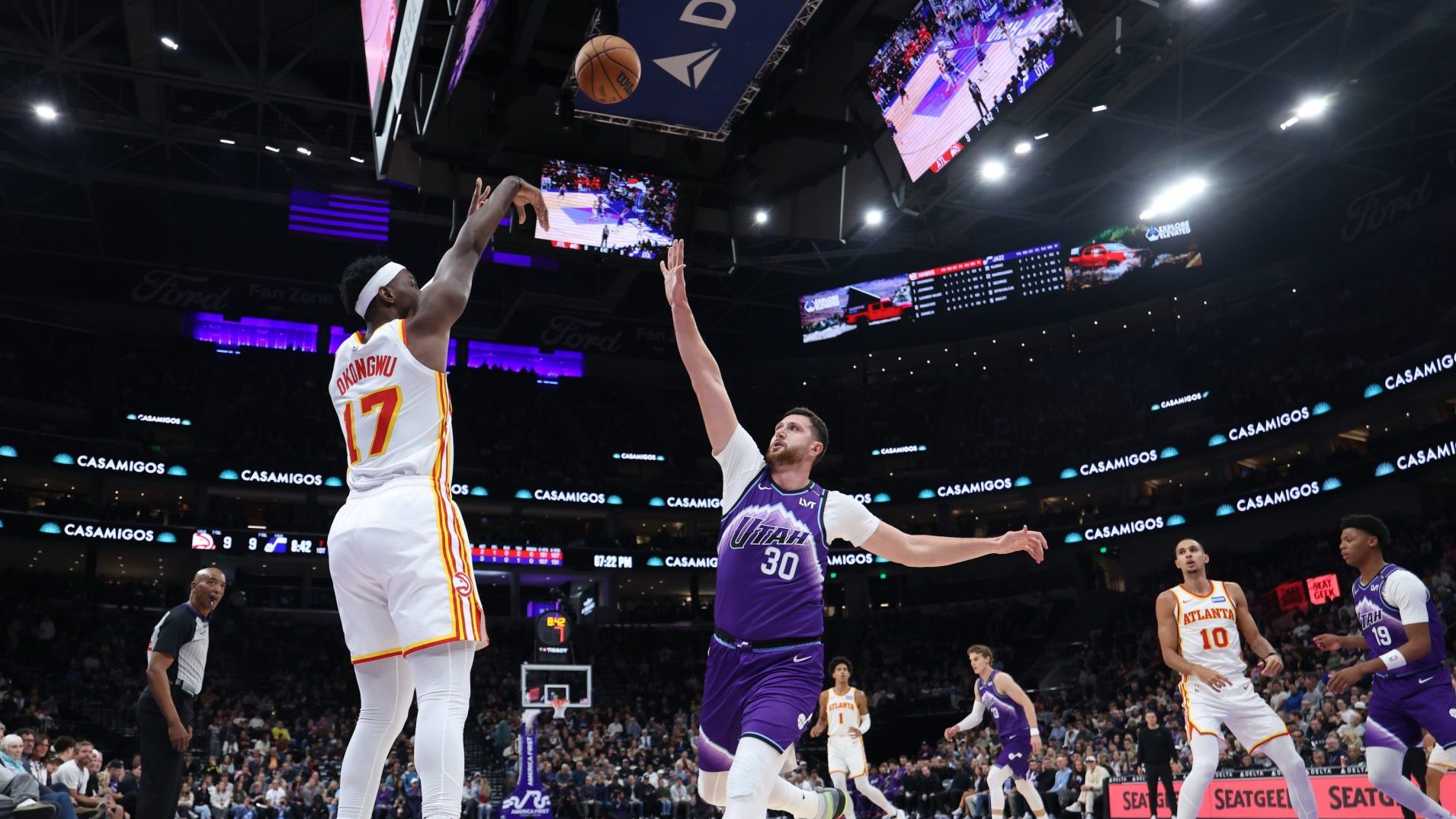 Nov 13, 2025; Salt Lake City, Utah, USA; Atlanta Hawks forward Onyeka Okongwu (17) makes a three point basket over Utah Jazz center Jusuf Nurkic (30) during the first quarter at Delta Center.
