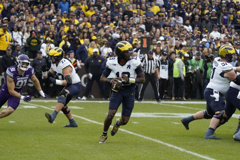 Nov 15, 2025; Chicago, Illinois, USA; Michigan Wolverines quarterback Bryce Underwood (19) throws the ball against the Northwestern Wildcats during the first half at Wrigley Field.