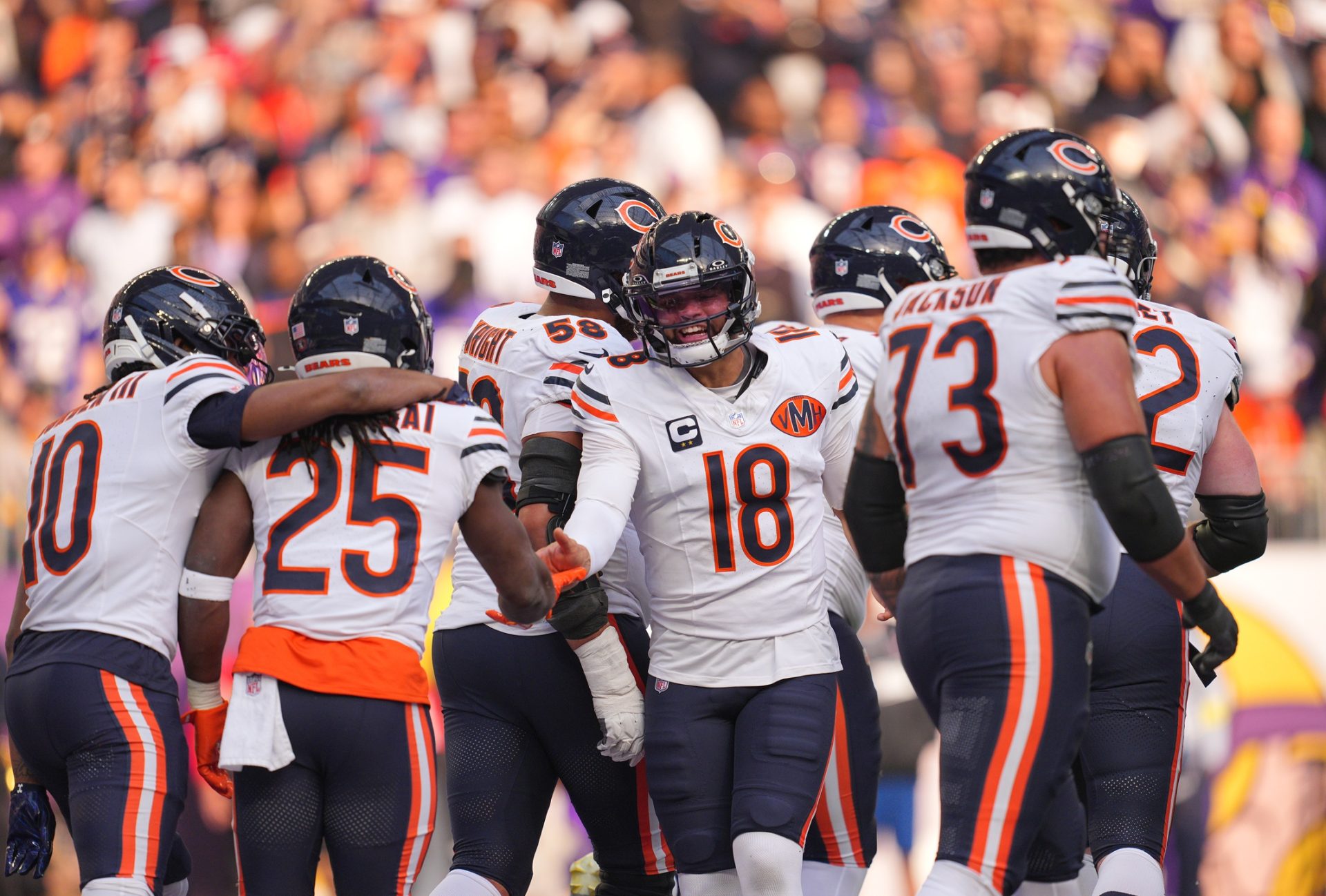 Nov 16, 2025; Minneapolis, Minnesota, USA; Chicago Bears running back Kyle Monangai (25) and quarterback Caleb Williams (18) celebrate a touchdown during the second quarter against the Minnesota Vikings at U.S. Bank Stadium.