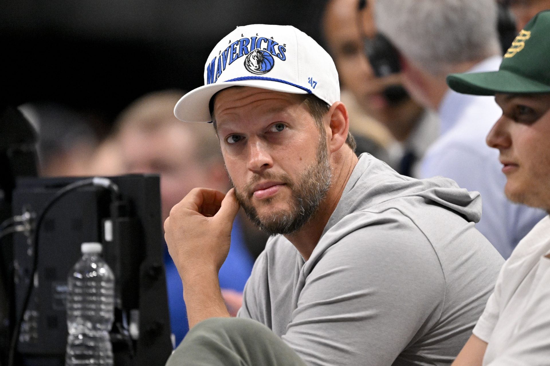 Nov 19, 2025; Dallas, Texas, USA; Los Angeles Dodgers pitcher Clayton Kershaw looks on during the second quarter between the Dallas Mavericks and the New York Knicks at the American Airlines Center.
