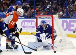 Nov 24, 2025; Tampa, Florida, USA; Tampa Bay Lightning goaltender Andrei Vasilevskiy (88) defends the puck from Philadelphia Flyers right wing Garnet Hathaway (19) during the second period at Benchmark International Arena.
