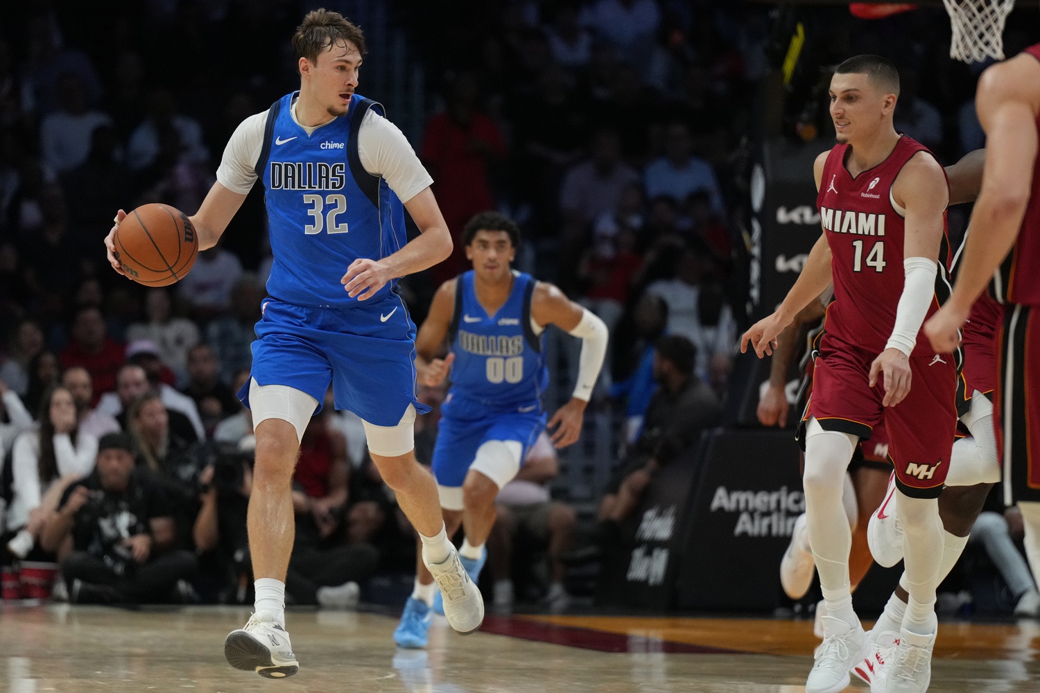 Nov 24, 2025; Miami, Florida, USA; Dallas Mavericks forward Cooper Flagg (32) brings the ball up the court against the Miami Heat during the second half at Kaseya Center.