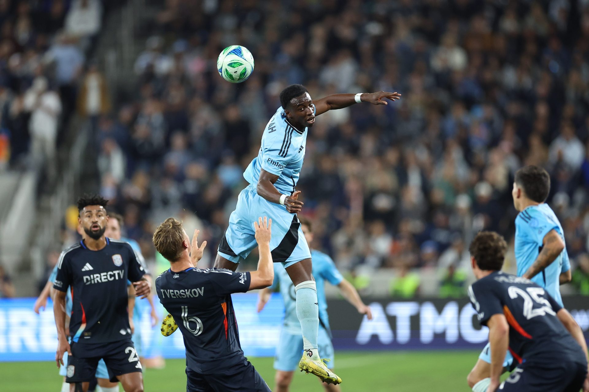 Nov 24, 2025; San Diego, California, USA; Minnesota United forward Kelvin Yeboah (9) heads the ball against San Diego FC defender Jeppe Tverskov (6) during the first half at Snapdragon Stadium.