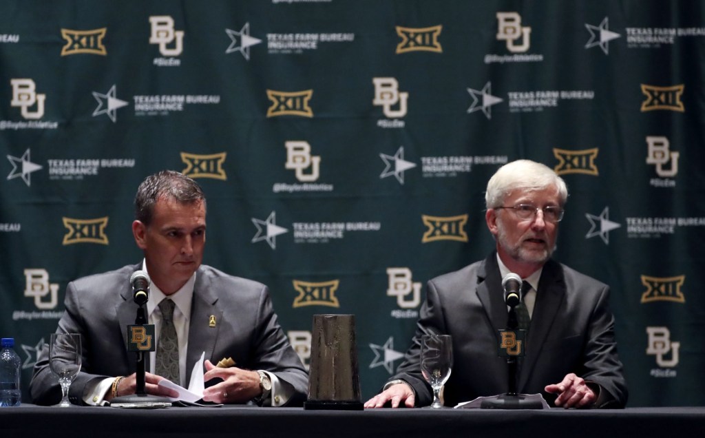 Jul 18, 2016; Dallas, TX, USA; Baylor Bears interim president David E. Garland (right) and new athletic director Mack Rhoades (left) speak at a press conference during the Big 12 Media Days at Omni Dallas Hotel.