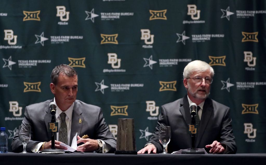 Jul 18, 2016; Dallas, TX, USA; Baylor Bears interim president David E. Garland (right) and new athletic director Mack Rhoades (left) speak at a press conference during the Big 12 Media Days at Omni Dallas Hotel.