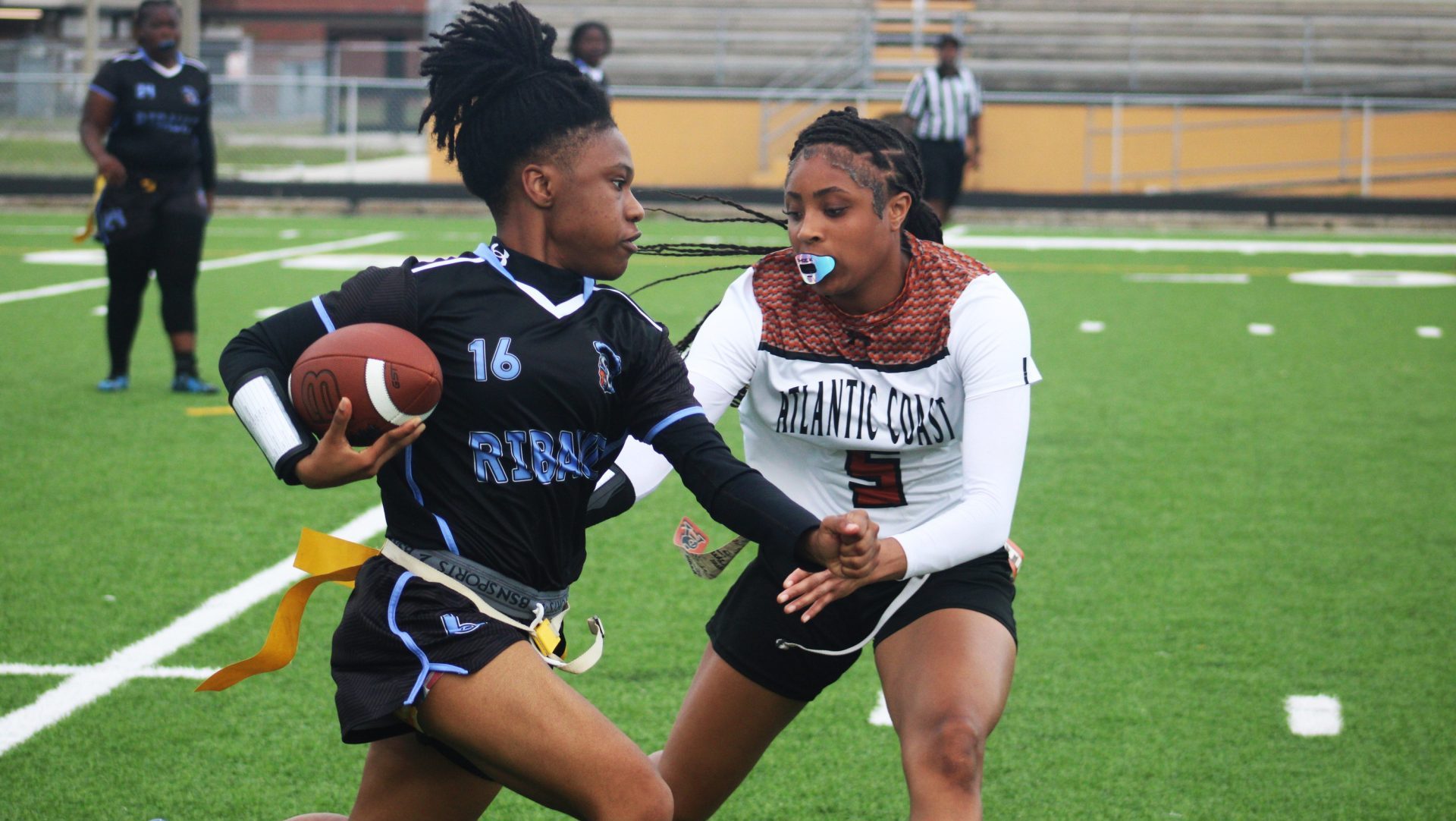 Atlantic Coast's Kylie Johnson (5) makes a flag pull against Ribault during the Gateway Conference high school flag football tournament on April 2, 2024.