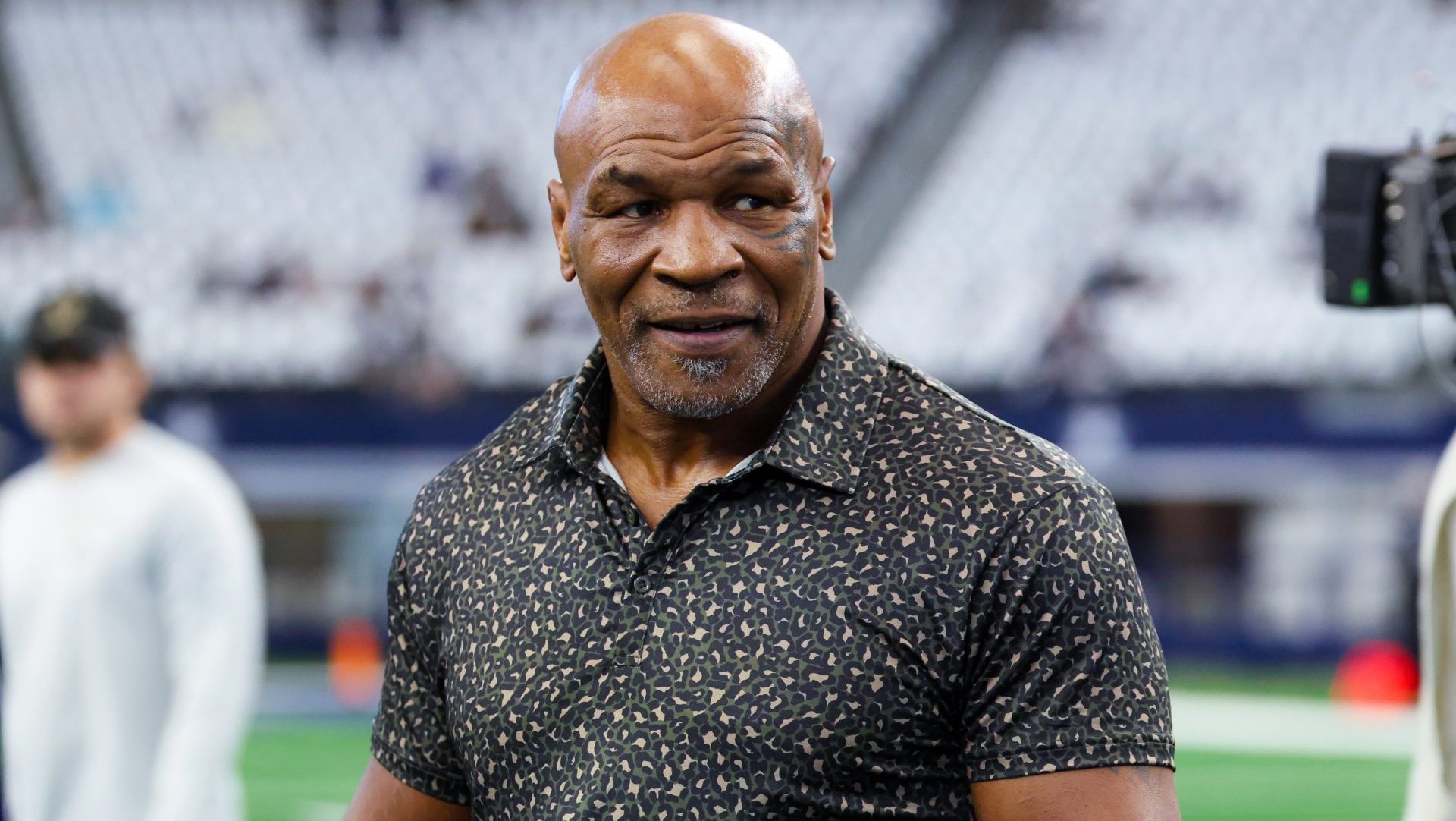 Sep 15, 2024; Arlington, Texas, USA; Boxer Mike Tyson on the field before the game between the Dallas Cowboys and New Orleans Saints at AT&T Stadium.