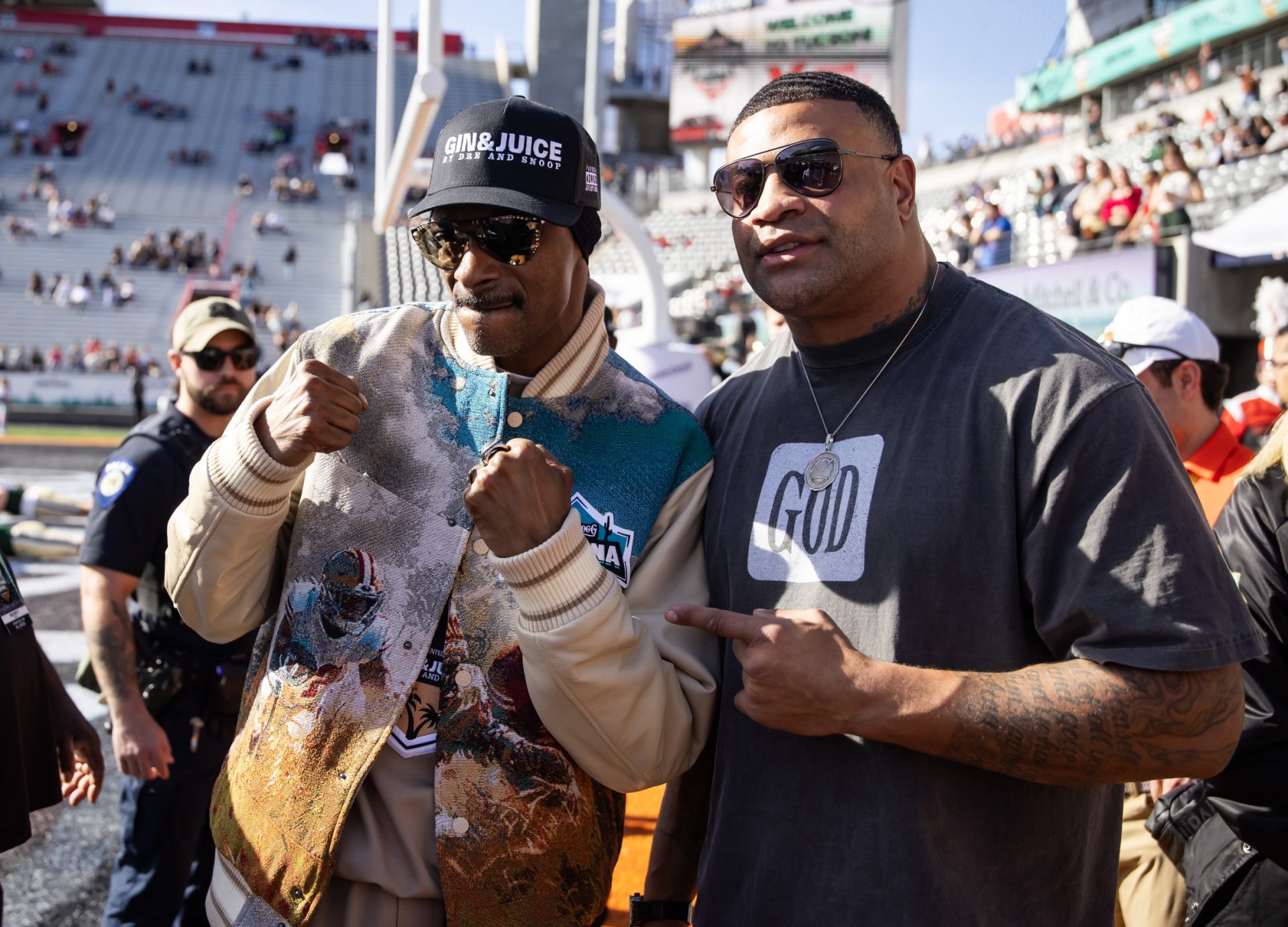 Dec 28, 2024; Tucson, AZ, USA; Rapper Snoop Dogg (left) with Shawne Merriman during the Colorado State Rams game against the Miami (OH) RedHawks in the Snoop Dogg Arizona Bowl at Arizona Stadium.