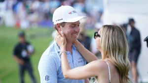 Ben Griffin with his fiancee Dana Myeroff on the 18th green after making the winning putting during the final round of the Charles Schwab Challenge golf tournament.
