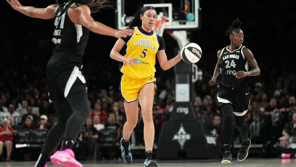 Jun 11, 2025; Las Vegas, Nevada, USA; Los Angeles Sparks forward Dearica Hamby (5) dribbles the ball against Las Vegas Aces center Kiah Stokes (41) during the second half of a WNBA basketball game at Michelob Ultra Arena.
