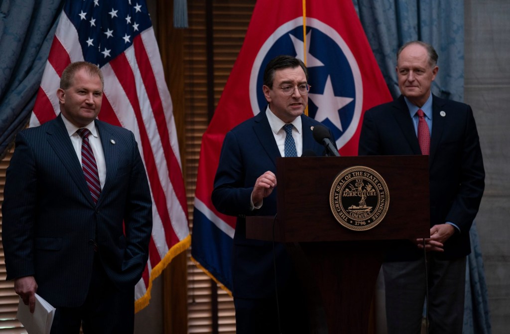 Tennessee Attorney General Jonathan Skrmetti addresses the media during a press conference discussing the U.S. Supreme Court's 6-3 decision which upheld Tennessee's ban on gender transition treatments for transgender minors at Tennessee State Capitol in Nashville, Tenn., Wednesday, June 18, 2025. House Majority Leader William Lamberth, R-Portland, left, and Senate Majority Leader Jack Johnson, R-Franklin join him on stage.