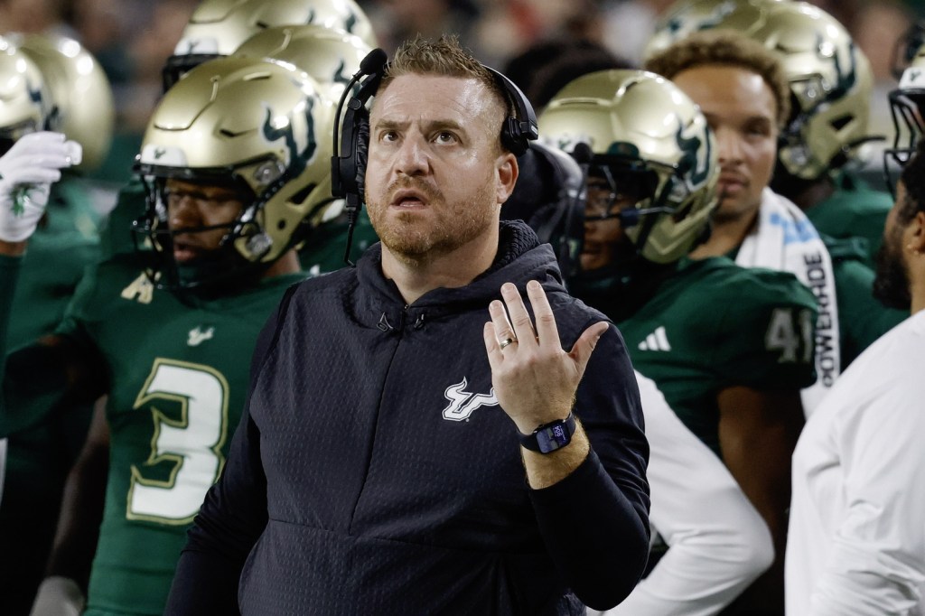 Oct 18, 2025; Tampa, Florida, USA; South Florida Bulls head coach Alex Golesh reacts to a replay during the second quarter against the Florida Atlantic Owls at Raymond James Stadium.