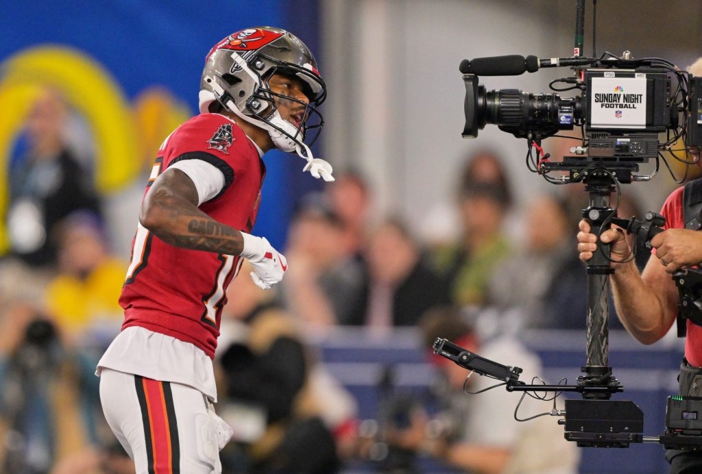 Nov 23, 2025; Inglewood, California, USA; Tampa Bay Buccaneers wide receiver Tez Johnson (15) poses for a television camera after scoring a touchdown against the Los Angeles Rams during the second quarter at SoFi Stadium.