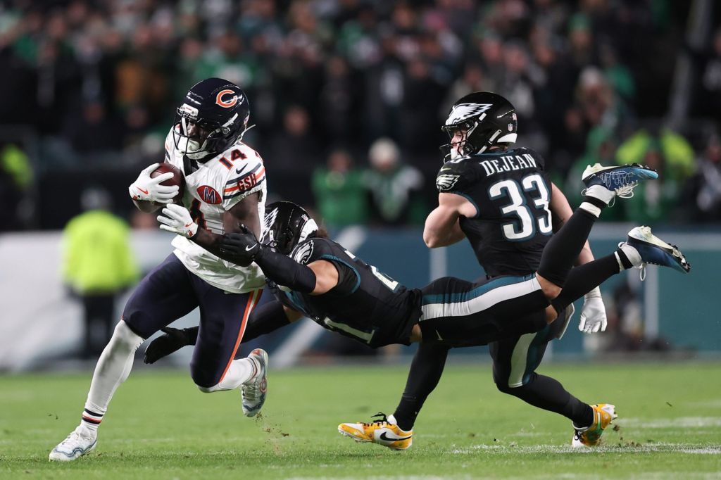 Nov 28, 2025; Philadelphia, Pennsylvania, USA; Chicago Bears wide receiver Olamide Zaccheaus (14) avoids a tackle by Philadelphia Eagles safety Sydney Brown (21) during the fourth quarter of the game at Lincoln Financial Field.