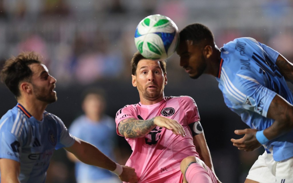 Nov 29, 2025; Fort Lauderdale, Florida, USA; Inter Miami CF forward Lionel Messi (10) defends against New York City FC defender Raul Gustavo (34) during the first half of the MLS Cup Playoffs Eastern Conference Final at Chase Stadium.