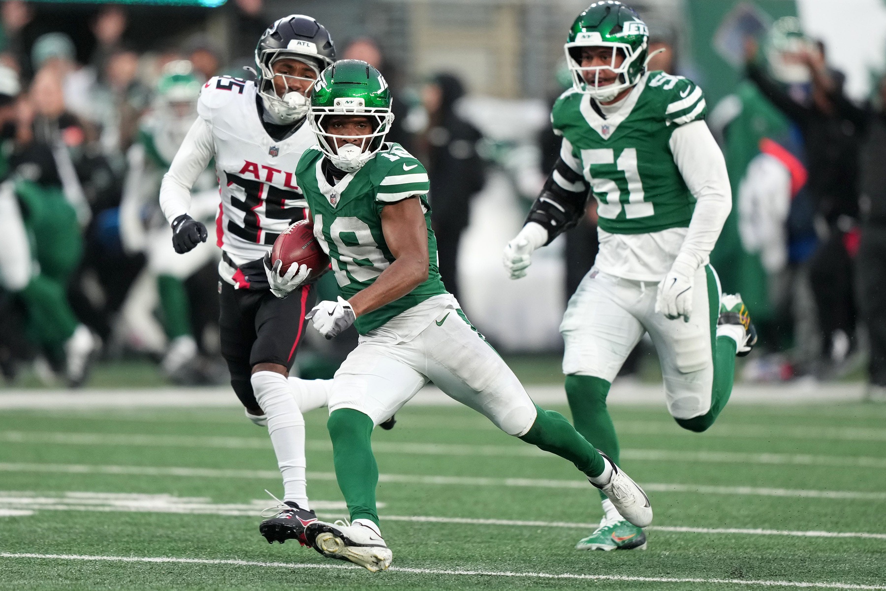 Nov 30, 2025; East Rutherford, New Jersey, USA; New York Jets wide receiver Isaiah Williams (18) makes a catch against the Atlanta Falcons during the second half at MetLife Stadium.