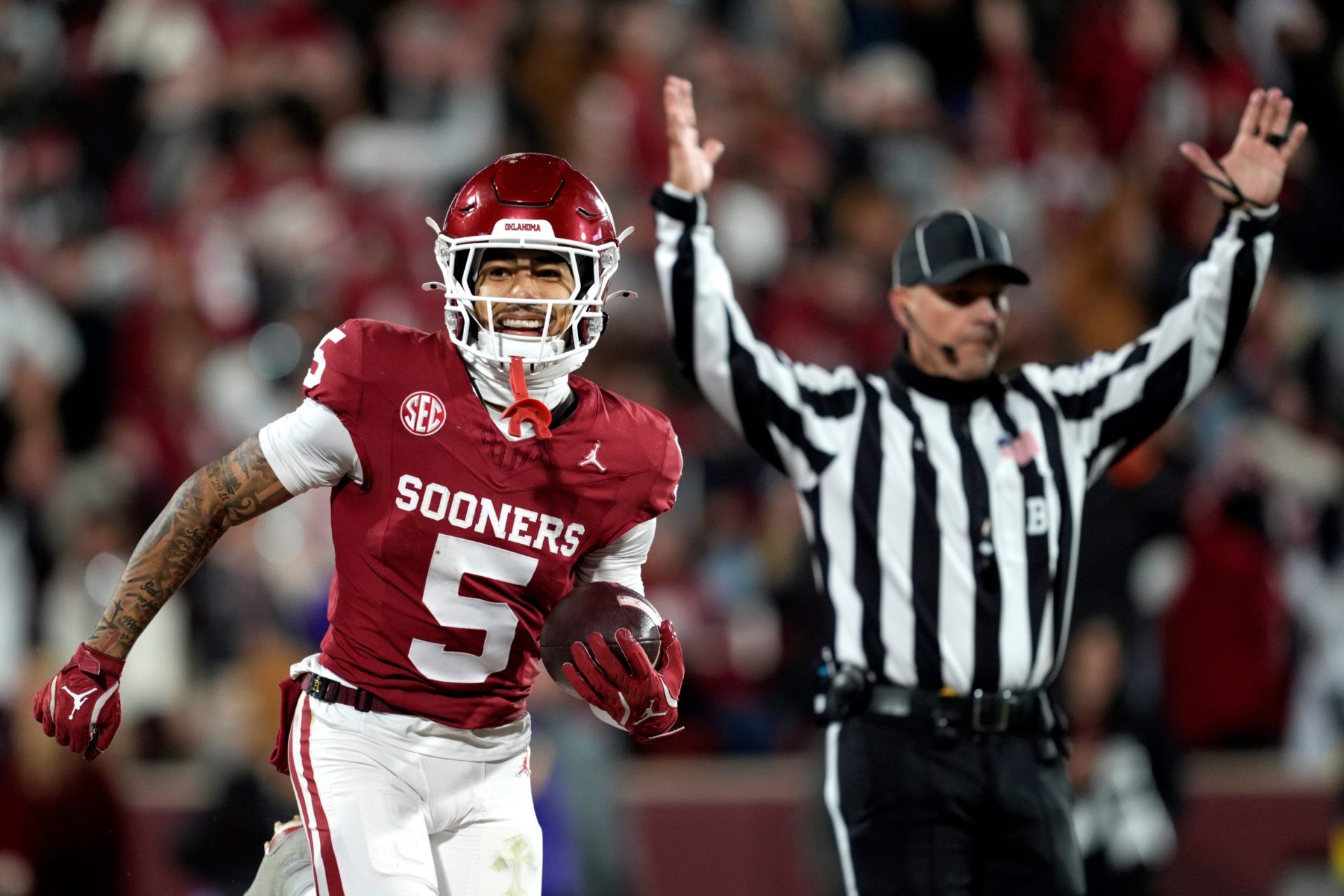 Oklahoma Sooners wide receiver Isaiah Sategna III (5) smiles as he scores a touchdown during a college football game between the University of Oklahoma Sooners (OU) and the LSU Tigers at Gaylord Family Ð Oklahoma Memorial Stadium in Norman, Okla., Saturday, Nov. 29, 2025. Oklahoma won 17-13.