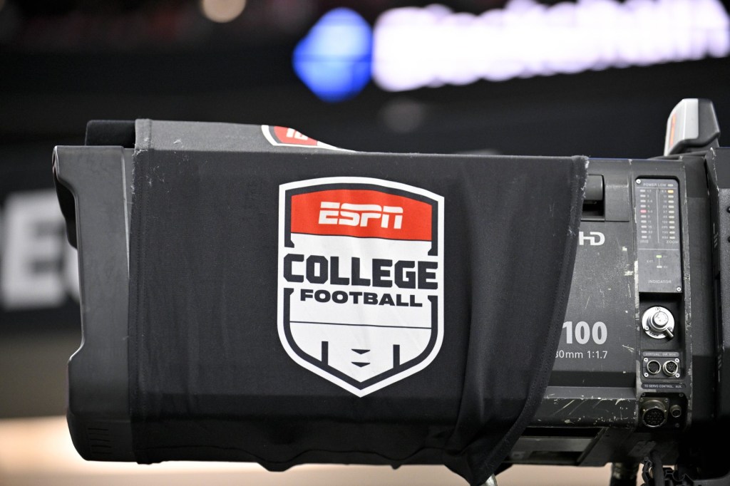 Dec 6, 2025; Arlington, TX, USA; A view of a tv camera and the ESPN college football logo before the game between the Texas Tech Red Raiders and the BYU Cougars at AT&T Stadium.