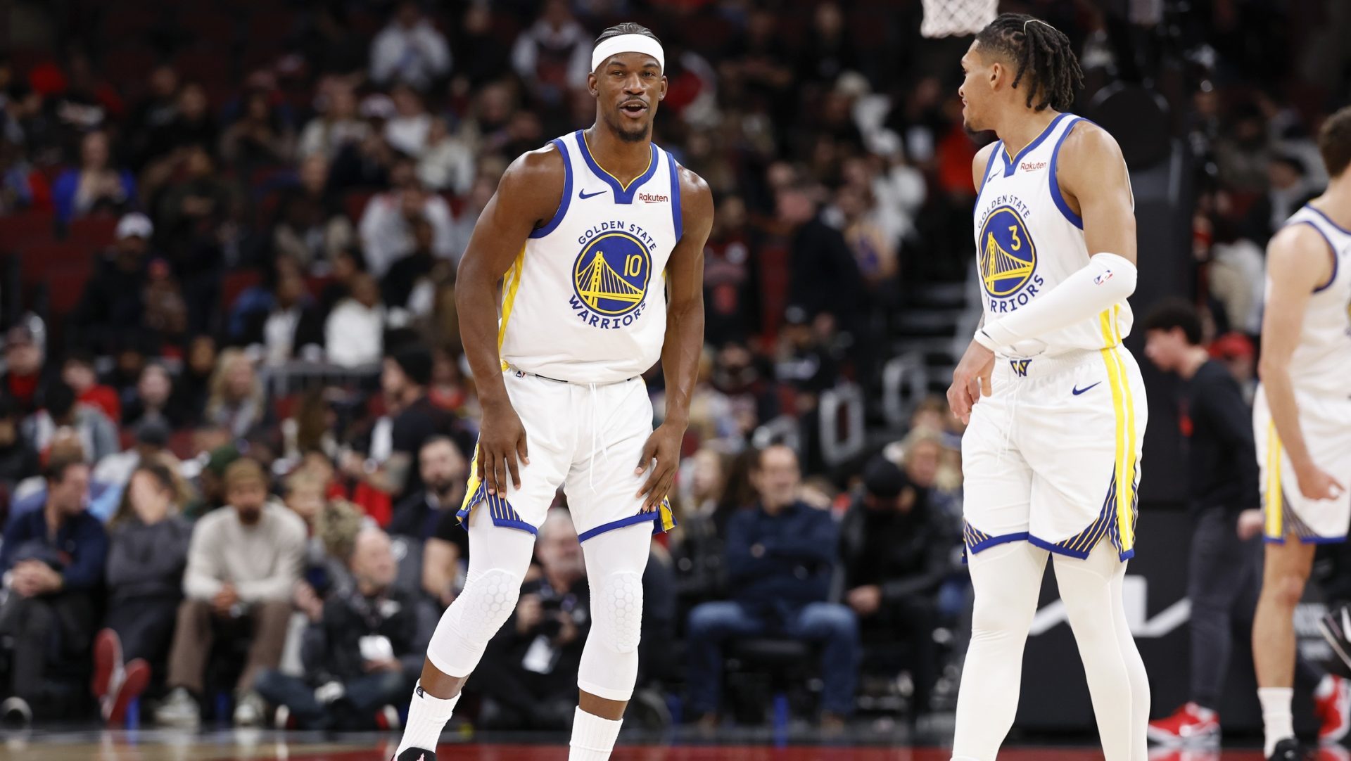 Dec 7, 2025; Chicago, Illinois, USA; Golden State Warriors forward Jimmy Butler III (10) chats with guard Will Richard (3) during the first half at United Center.