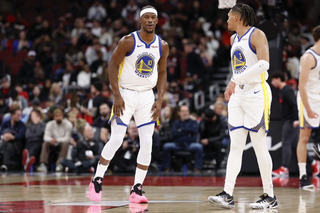Dec 7, 2025; Chicago, Illinois, USA; Golden State Warriors forward Jimmy Butler III (10) chats with guard Will Richard (3) during the first half at United Center.