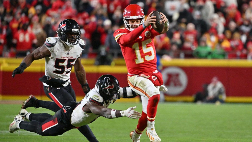 Dec 7, 2025; Kansas City, Missouri, USA; Kansas City Chiefs quarterback Patrick Mahomes (15) runs with the ball past Houston Texans linebacker Azeez Al-Shaair (0) during the third quarter at GEHA Field at Arrowhead Stadium.