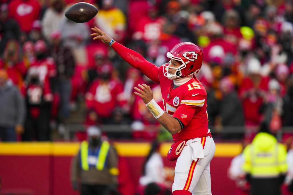 Dec 14, 2025; Kansas City, Missouri, USA; Kansas City Chiefs quarterback Patrick Mahomes (15) passes against the Los Angeles Chargers during the fourth quarter at GEHA Field at Arrowhead Stadium.