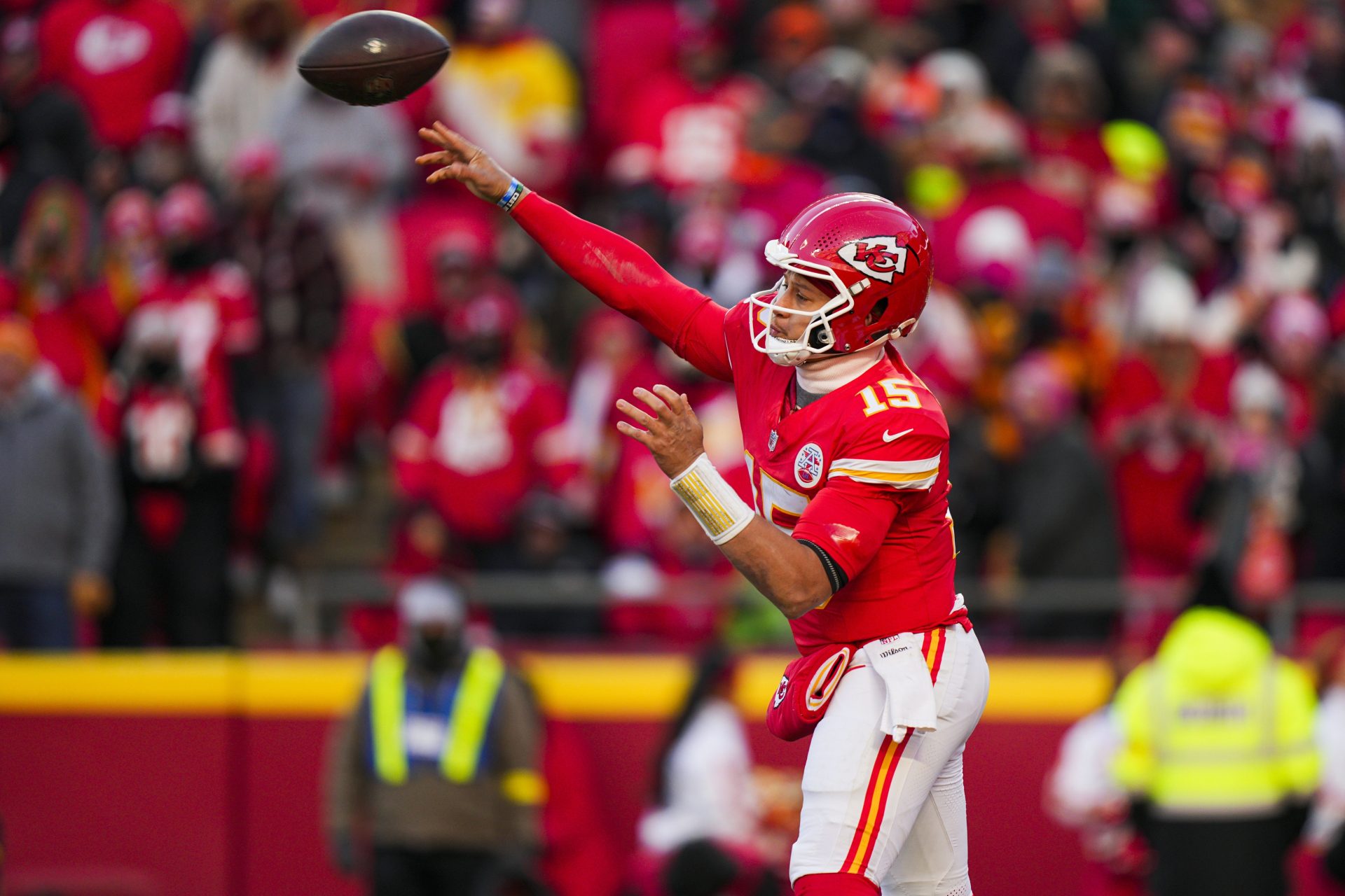 Dec 14, 2025; Kansas City, Missouri, USA; Kansas City Chiefs quarterback Patrick Mahomes (15) passes against the Los Angeles Chargers during the fourth quarter at GEHA Field at Arrowhead Stadium.