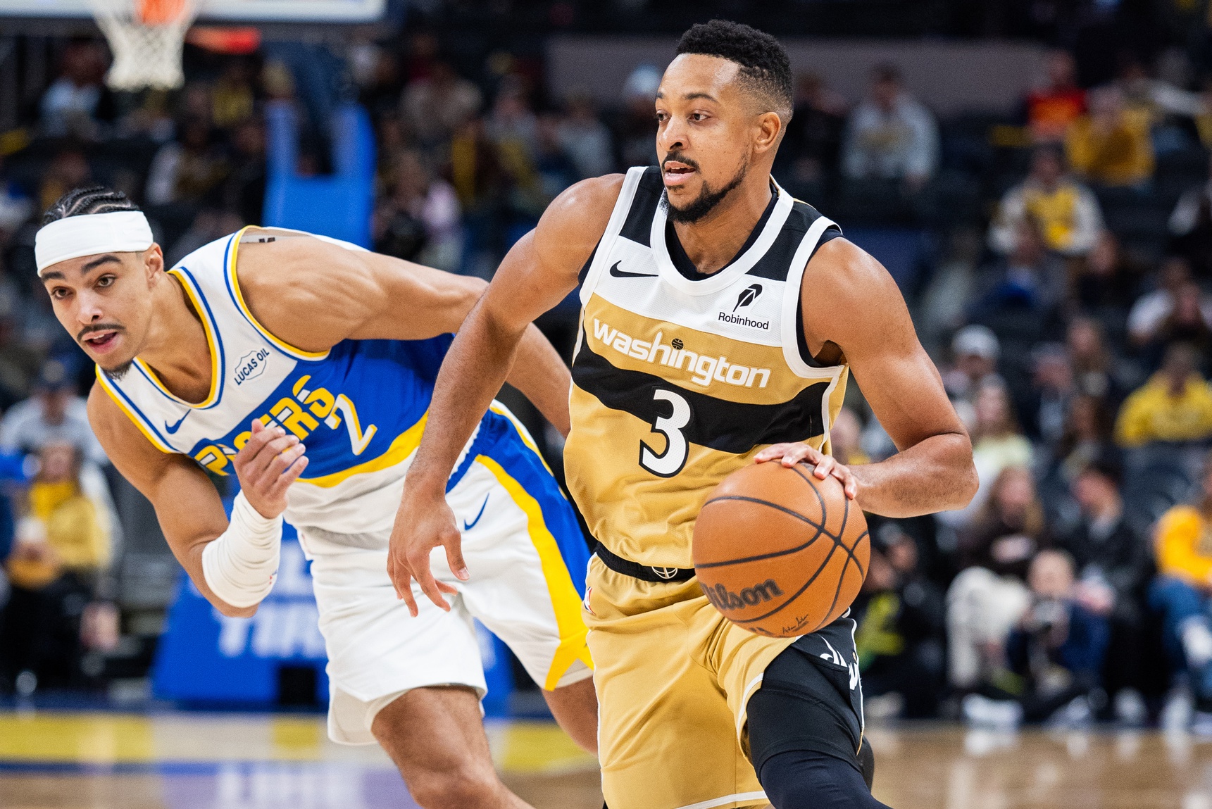 Dec 14, 2025; Indianapolis, Indiana, USA; Washington Wizards guard CJ McCollum (3) dribbles the ball while Indiana Pacers guard/forward Andrew Nembhard (2) defends in the second half at Gainbridge Fieldhouse.
