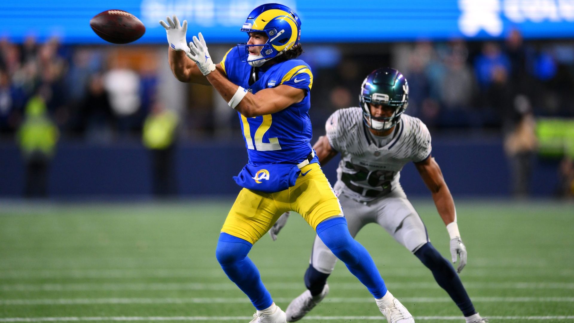 Dec 18, 2025; Seattle, Washington, USA; Los Angeles Rams wide receiver Puka Nacua (12) makes a catch against Seattle Seahawks cornerback Josh Jobe (29) in overtime at Lumen Field.