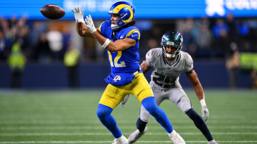 Dec 18, 2025; Seattle, Washington, USA; Los Angeles Rams wide receiver Puka Nacua (12) makes a catch against Seattle Seahawks cornerback Josh Jobe (29) in overtime at Lumen Field.