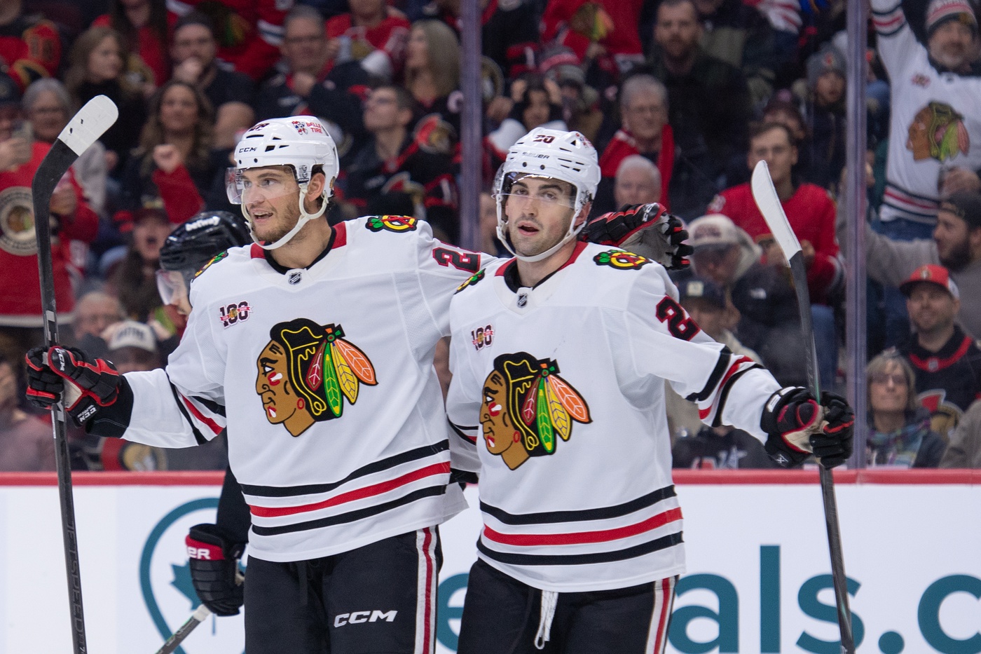 Dec 20, 2025; Ottawa, Ontario, CAN; Chicago Blackhawks left wing Andre Burakovsky (28) celebrates with center Ryan Greene (20) his goal scored in the second period against the Ottawa Senators at the Canadian Tire Centre.