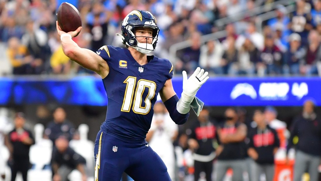 Dec 27, 2025; Inglewood, California, USA; Los Angeles Chargers quarterback Justin Herbert (10) throws a touchdown pass against the Houston Texans during the second half at SoFi Stadium.