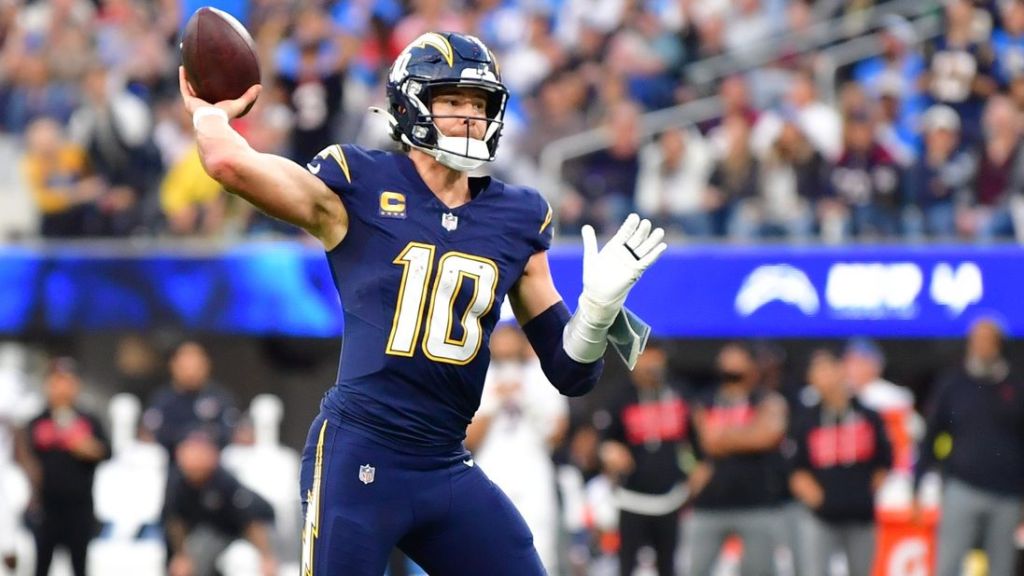 Dec 27, 2025; Inglewood, California, USA; Los Angeles Chargers quarterback Justin Herbert (10) throws a touchdown pass against the Houston Texans during the second half at SoFi Stadium.