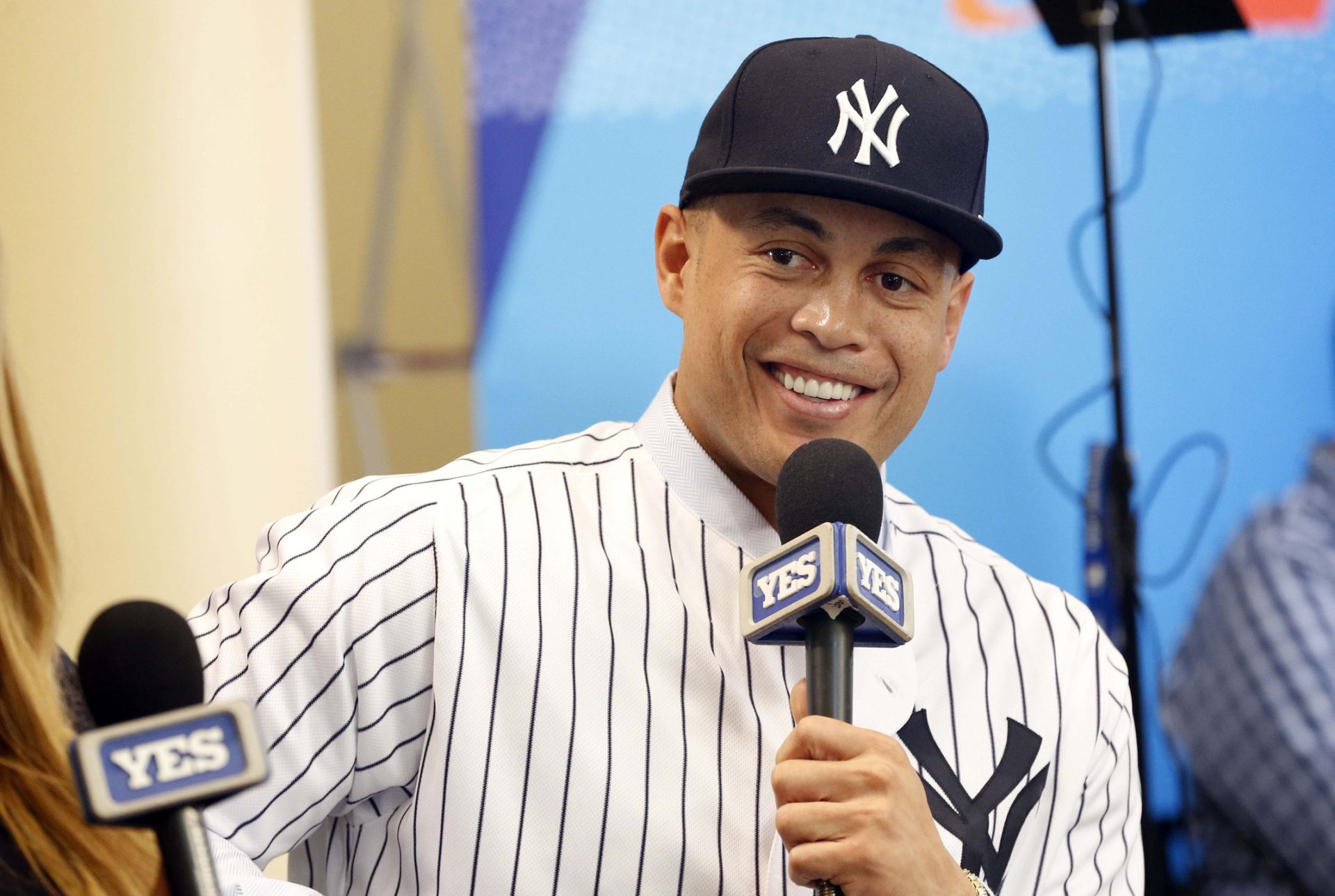 Dec 11, 2017; Orlando, FL, USA; New York Yankees outfielder Giancarlo Stanton (27) talks with Yes Network during the winter meetings at Walt Disney World Swan and Dolphin Resort.