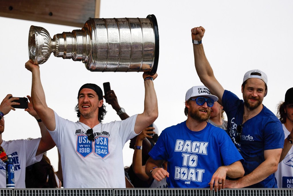 Jul 12, 2021; Tampa, FL, USA;  Tampa Bay Lightning defenseman Ryan McDonagh (27) hoists the Stanley Cup during the Stanley Cup Championship parade.