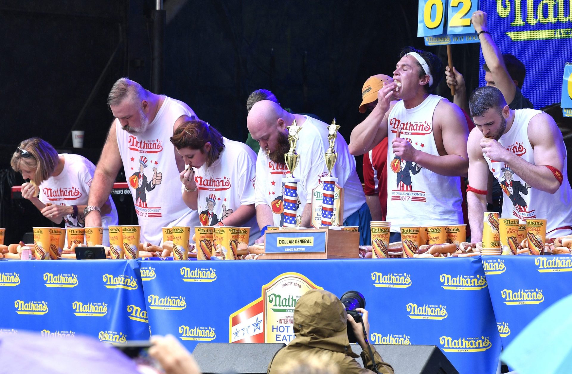 Contestants compete in the annual Nathan's hot dog eating contest at Tootsie's 57th Anniversary Birthday Bash on Lower Broadway in Nashville on Oct. 10, 2017.