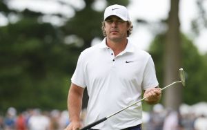 Aug 23, 2025; Detroit, Michigan, USA; Brooks Koepka of Smash GC lines up a putt on the 17th green during the semifinals of the LIV Golf Michigan Team Championship at The Cardinal at Saint John's Resort.