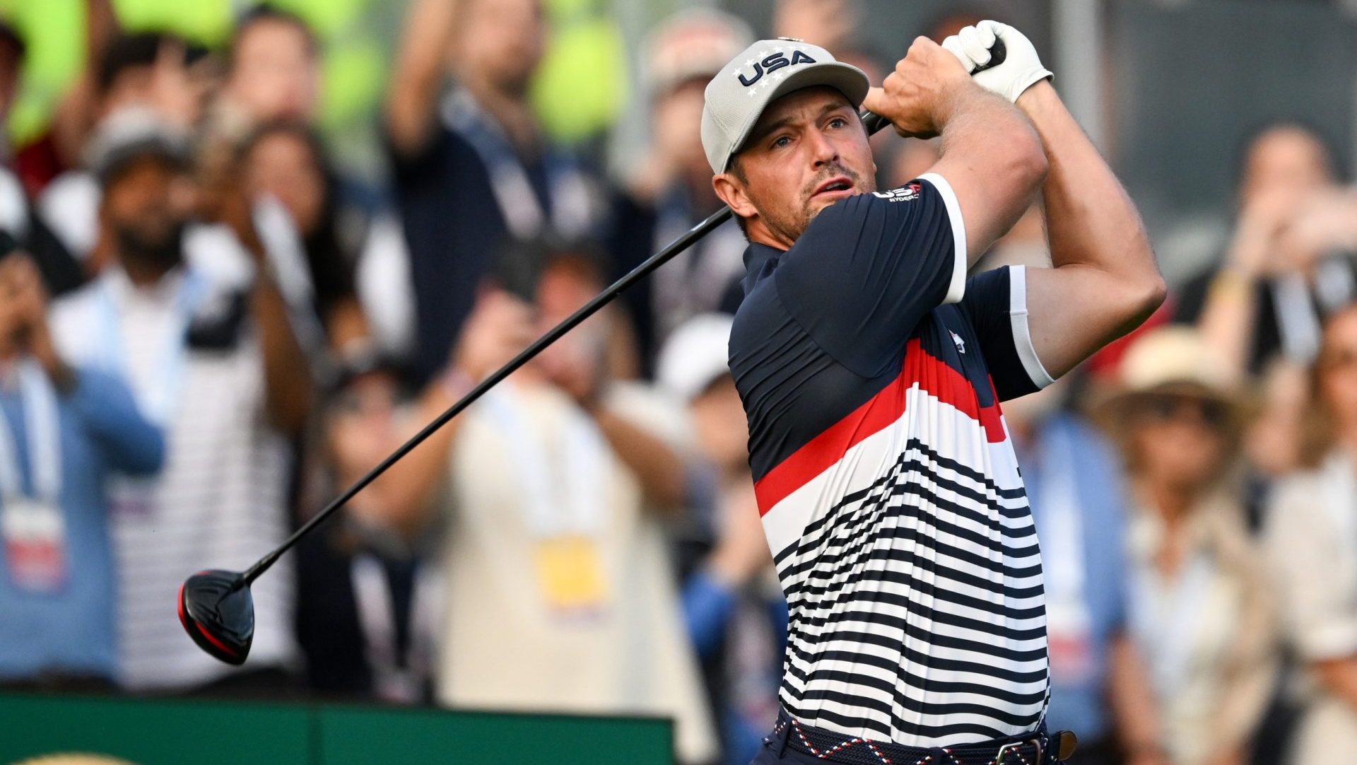 Sep 26, 2025; Bethpage, New York, USA; Team USA golfer Bryson DeChambeau plays his shot from the first tee on the first day of competition for the Ryder Cup at Bethpage Black.