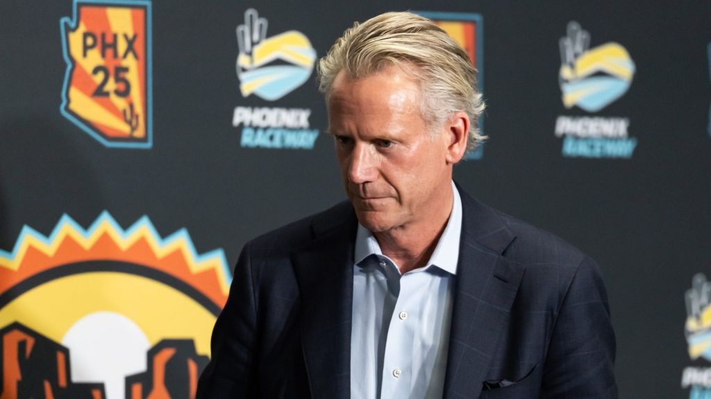 Oct 31, 2025; Avondale, Arizona, USA; NASCAR commissioner Steve Phelps walks off the stage following the state of the sport press conference in the media center at Phoenix Raceway.