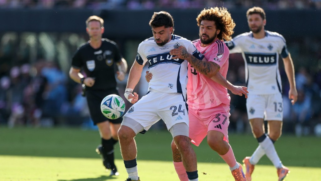 Dec 6, 2025; Fort Lauderdale, Florida, USA; Vancouver Whitecaps FC forward Brian White (24) controls the ball defended by Inter Miami defender Maximiliano Falcon (37) in the first half during the 2025 MLS Cup at Chase Stadium.