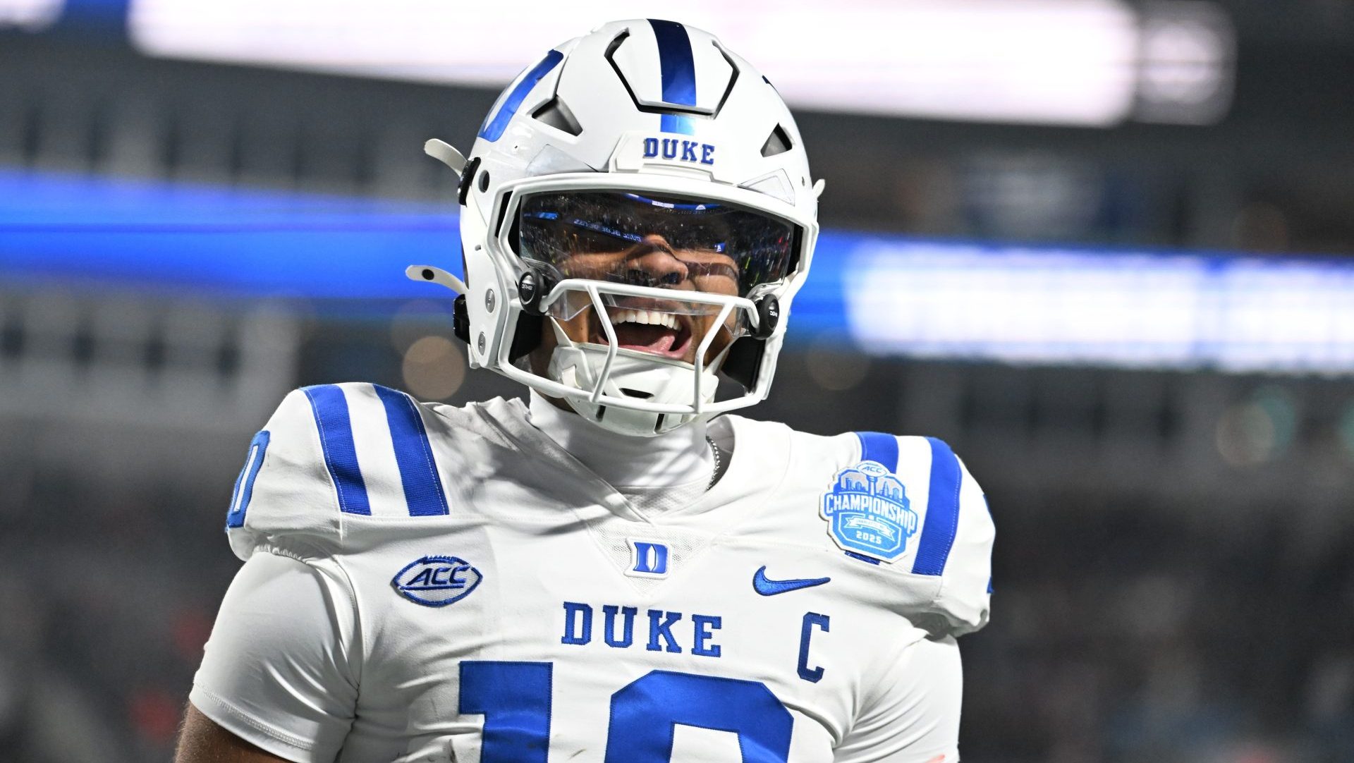 Dec 6, 2025; Charlotte, NC, USA; Duke Blue Devils quarterback Darian Mensah (10) celebrates after the Blue Devils score a touchdown in overtime during the ACC Championship game at Bank of America Stadium.