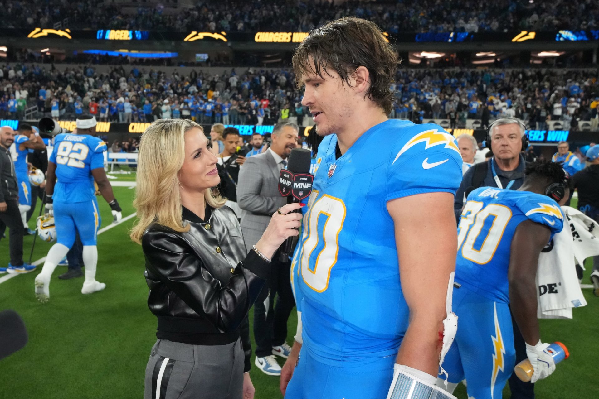Dec 8, 2025; Inglewood, California, USA; ESPN sideline reporter Laura Rutledge (left) interviews Los Angeles Chargers quarterback Justin Herbert (10) after the game against the Philadelphia Eagles at SoFi Stadium.