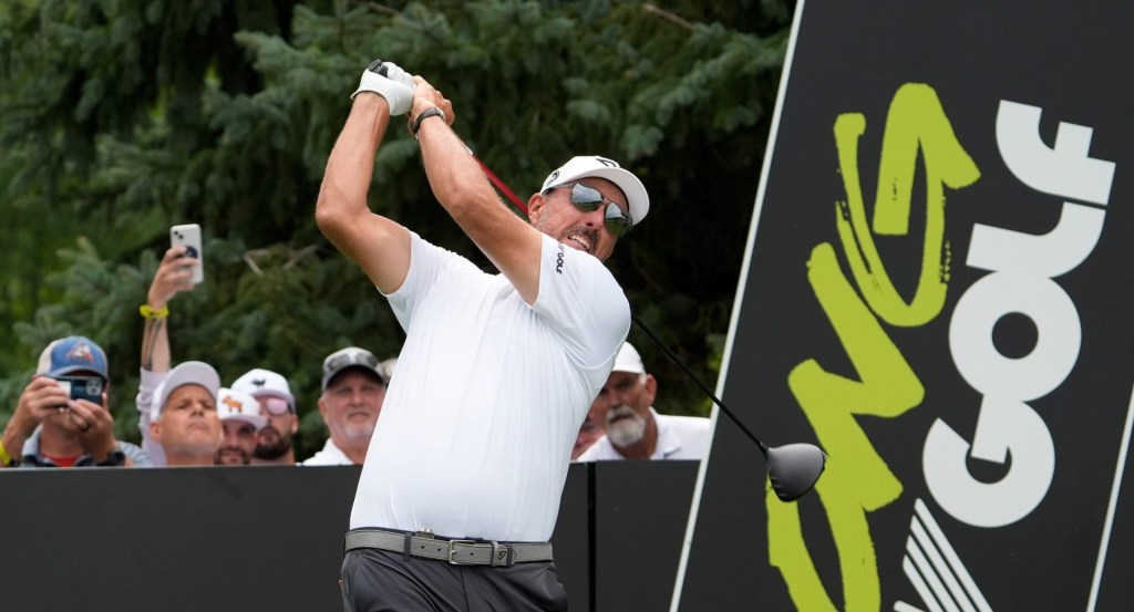 Phil Mickelson of Team HyFlyers GC hits off the fifth tee during the LIV Golf Michigan Team Championship semifinals at The Cardinal at St. John’s in Plymouth on Saturday, Aug. 23, 2025.