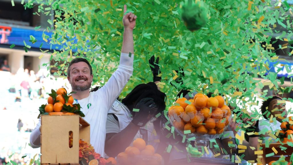 Jan 1, 2026; Miami Gardens, FL, USA; Oregon Ducks head coach Dan Lanning and players on the podium to receive the champions trophy following the 2025 Orange Bowl and quarterfinal game of the College Football Playoff against the Texas Tech Red Raiders at Hard Rock Stadium.