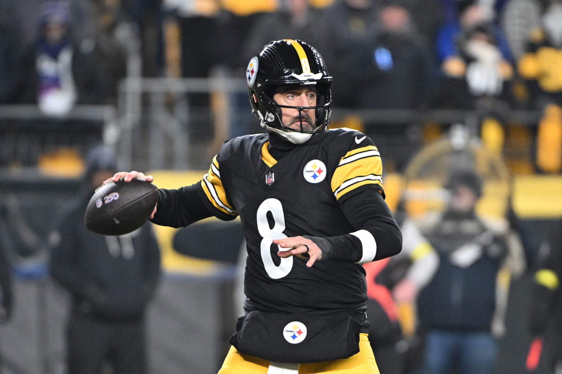 Jan 4, 2026; Pittsburgh, Pennsylvania, USA; Pittsburgh Steelers quarterback Aaron Rodgers (8) drops back to pass against the Baltimore Ravens during the first half at Acrisure Stadium.