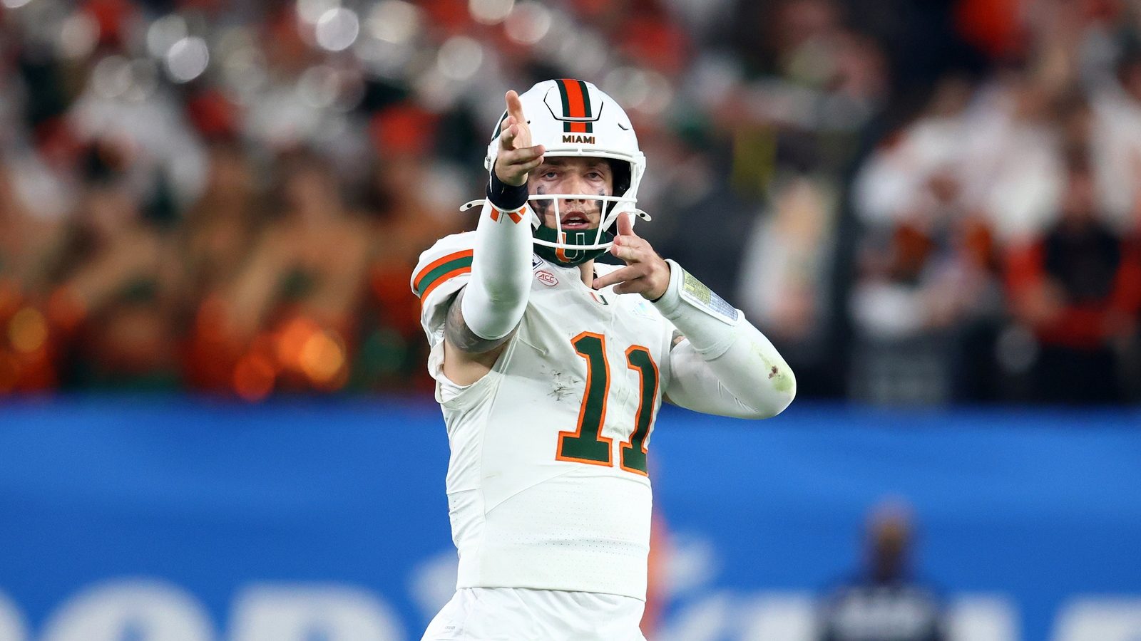 Jan 8, 2026; Glendale, AZ, USA; Miami Hurricanes quarterback Carson Beck (11) reacts against the Mississippi Rebels in the second half during the 2026 Fiesta Bowl and semifinal game of the College Football Playoff at State Farm Stadium