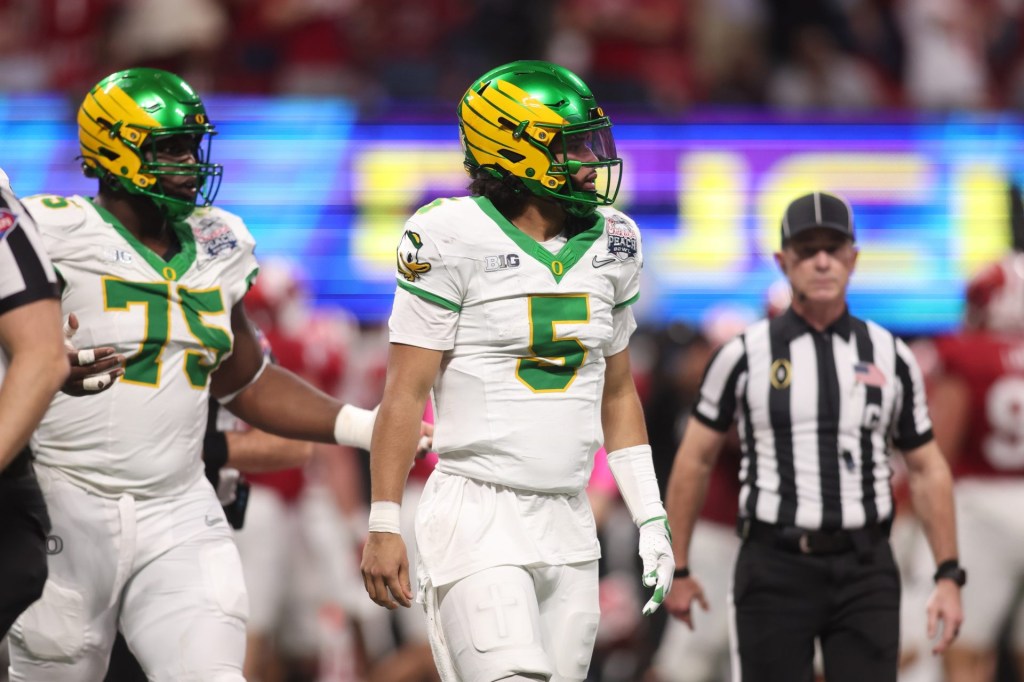 Jan 9, 2026; Atlanta, GA, USA; Oregon Ducks quarterback Dante Moore (5) reacts after a fumble against the Indiana Hoosiers during the first half of the 2025 Peach Bowl and semifinal game of the College Football Playoff at Mercedes-Benz Stadium.