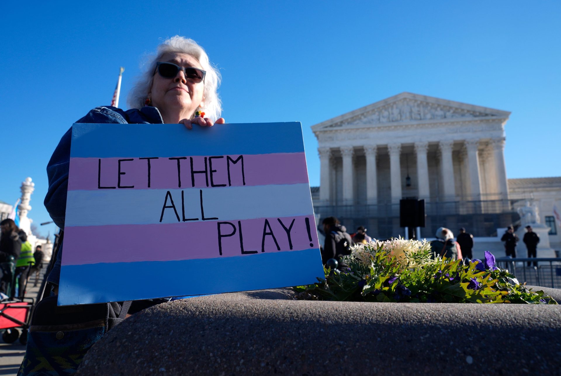 Demonstrators rally outside of the Supreme Court as the justices hear oral arguments in two cases related to transgender athlete participation in sports in Washington, DC, on Jan. 13, 2026. The cases, Little v. Hecox and West Virginia v. B.P.J., seek to decide whether laws that limit participation to women and girls based on sex violate the equal protection clause of the 14th Amendment.